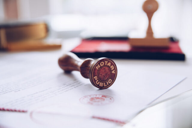 Close up of a notary stamp and valid paperwork.