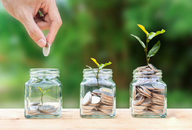 There are three jars filled with different coin amounts; a hand drops a coin in the first that is mostly empty with a little plant sprout, the second jar is half full of coins with a bigger sprout, and the third is overflowing with coins and a large sprout.